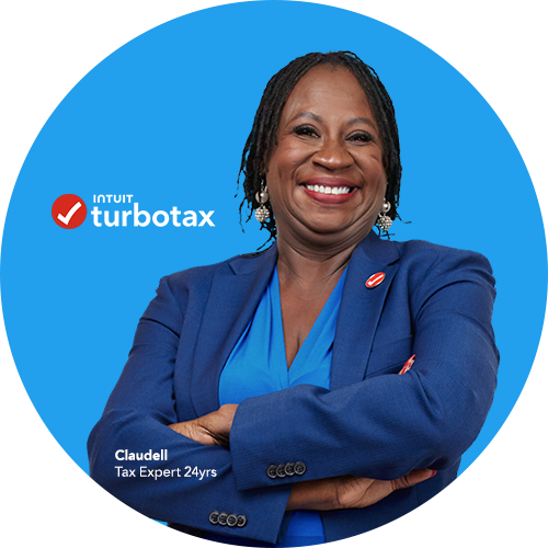 A TurboTax expert with her arms crossed, smiling at the camera