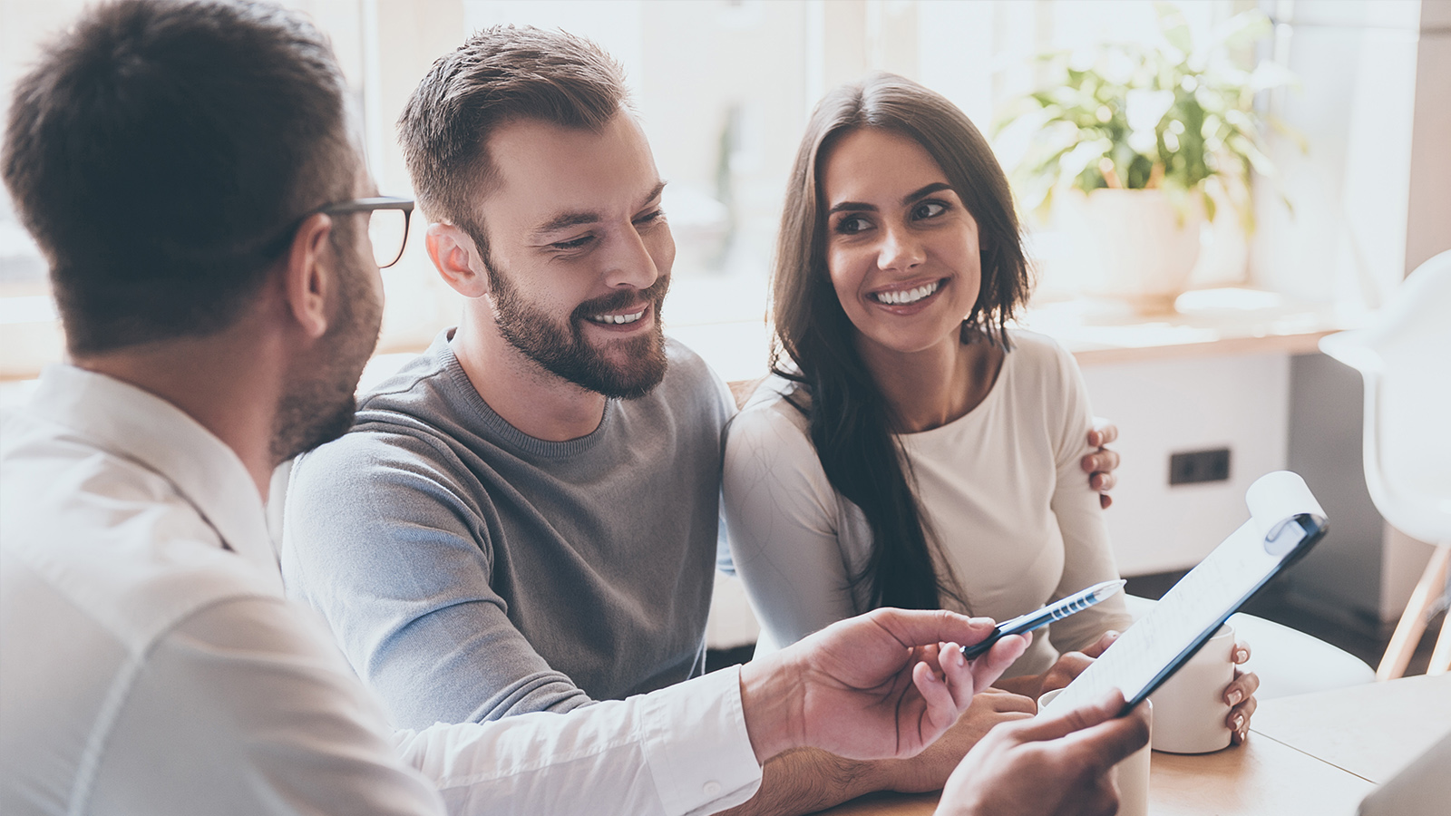 People reading a financial document together