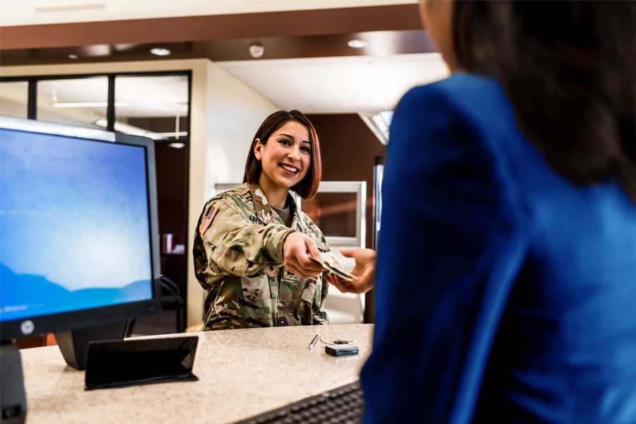 a military person in uniform visiting the bank