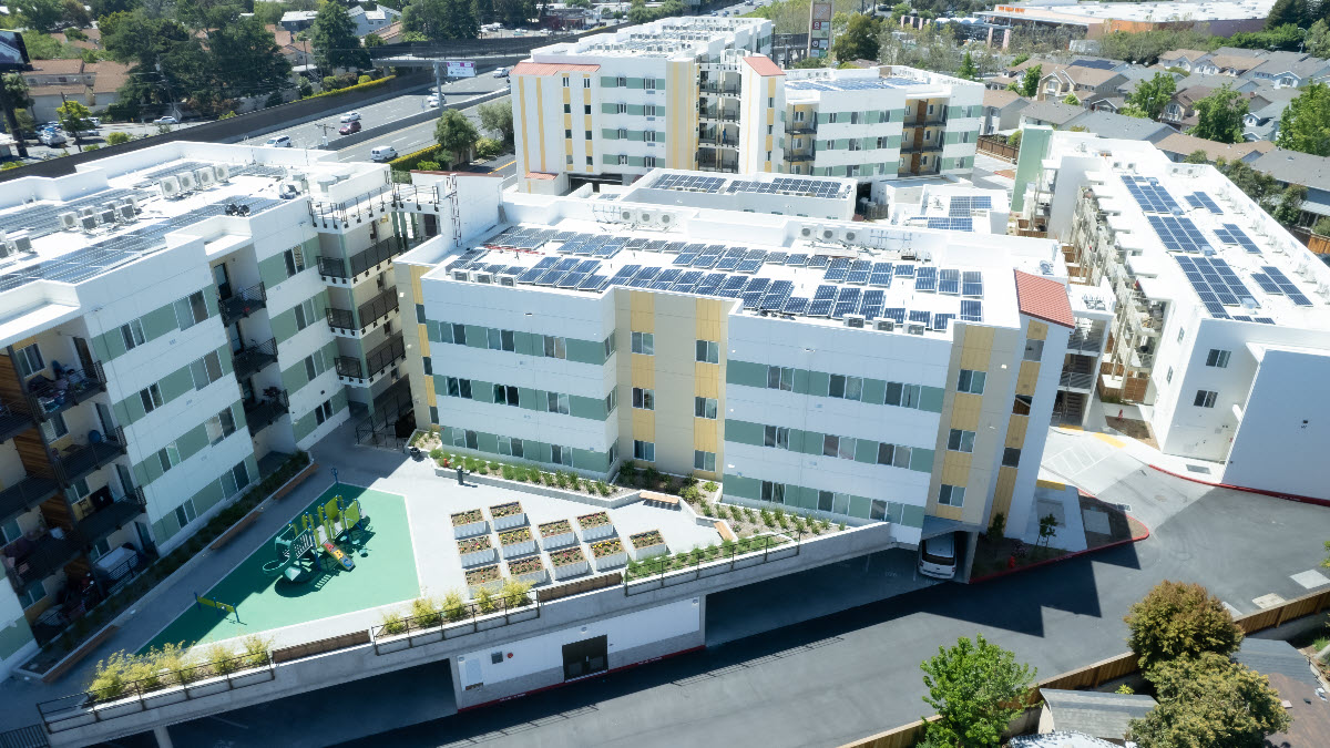 Aerial photo showing five residential apartment buildings that are part of the Light Tree complex,