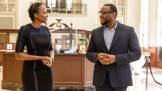 U.S. Bank Business Access Advisor Micae Brown chatting with small business owner Melvin Cannon at a Chicago branch