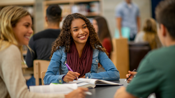 Woman smiling after reviewing U.S. Bank school banking program