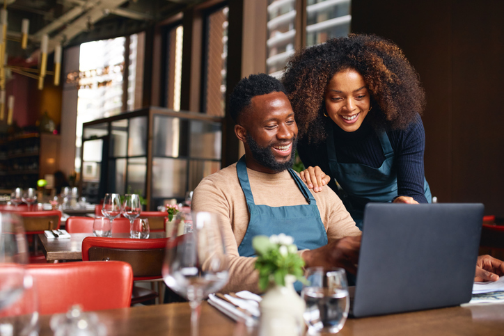 Image of man and woman looking at screen