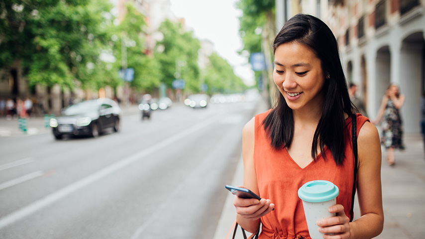 woman smiling after opening an elite money market savings account