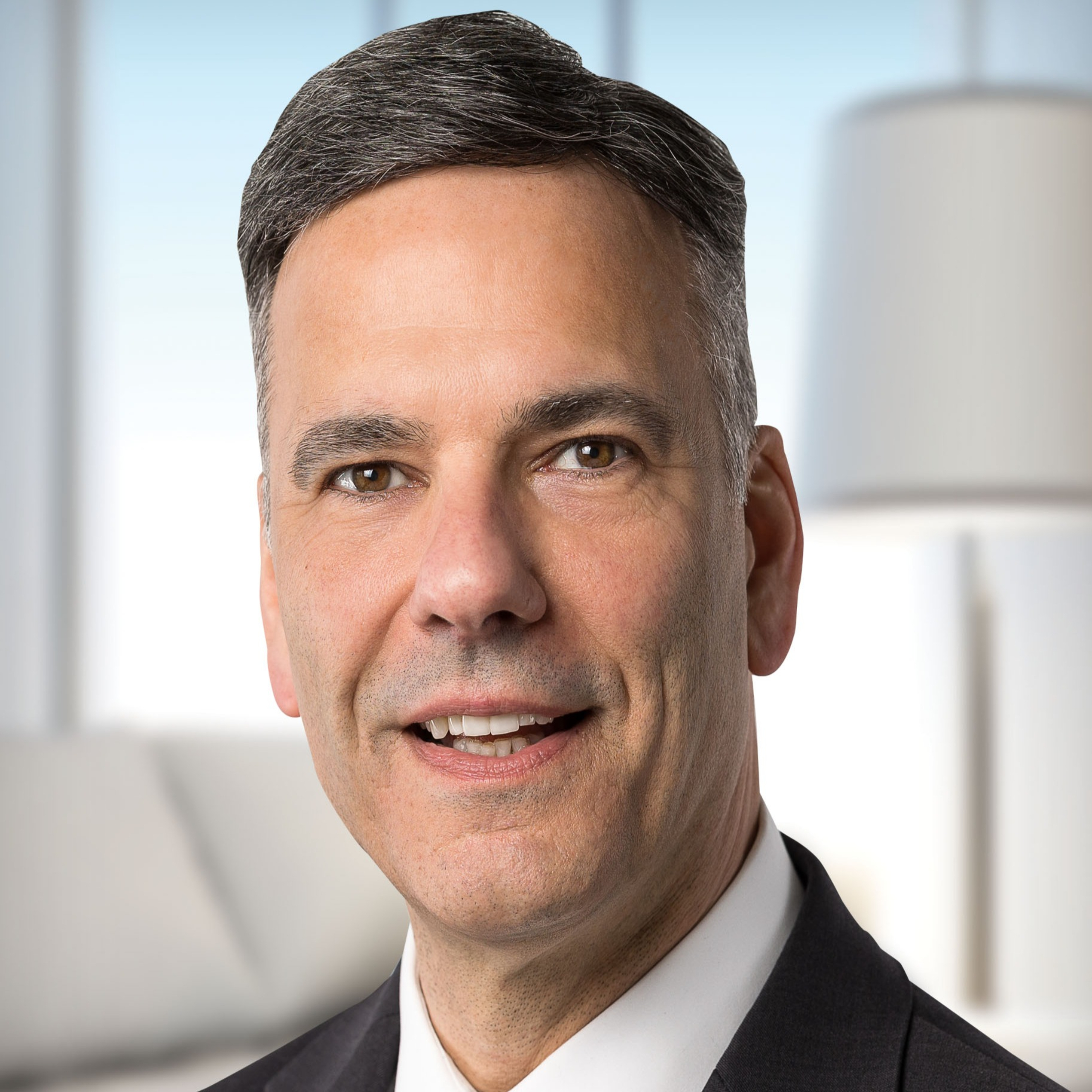 Headshot of Jay Martin wearing a suit and tie