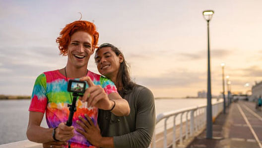 A traveling couple poses for a selfie.