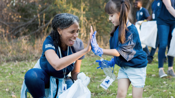 women and girl volunteering