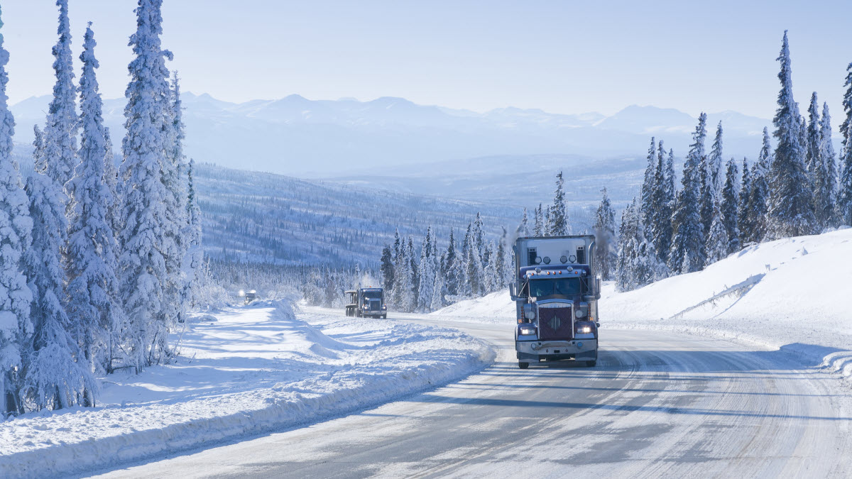 Semi truck on a highway in the winter time