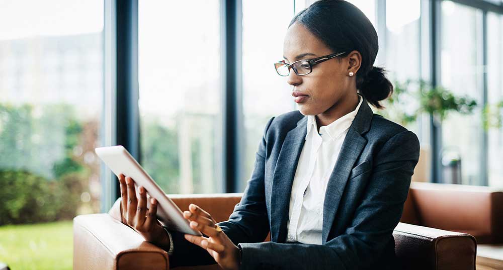 woman doing work on an ipad