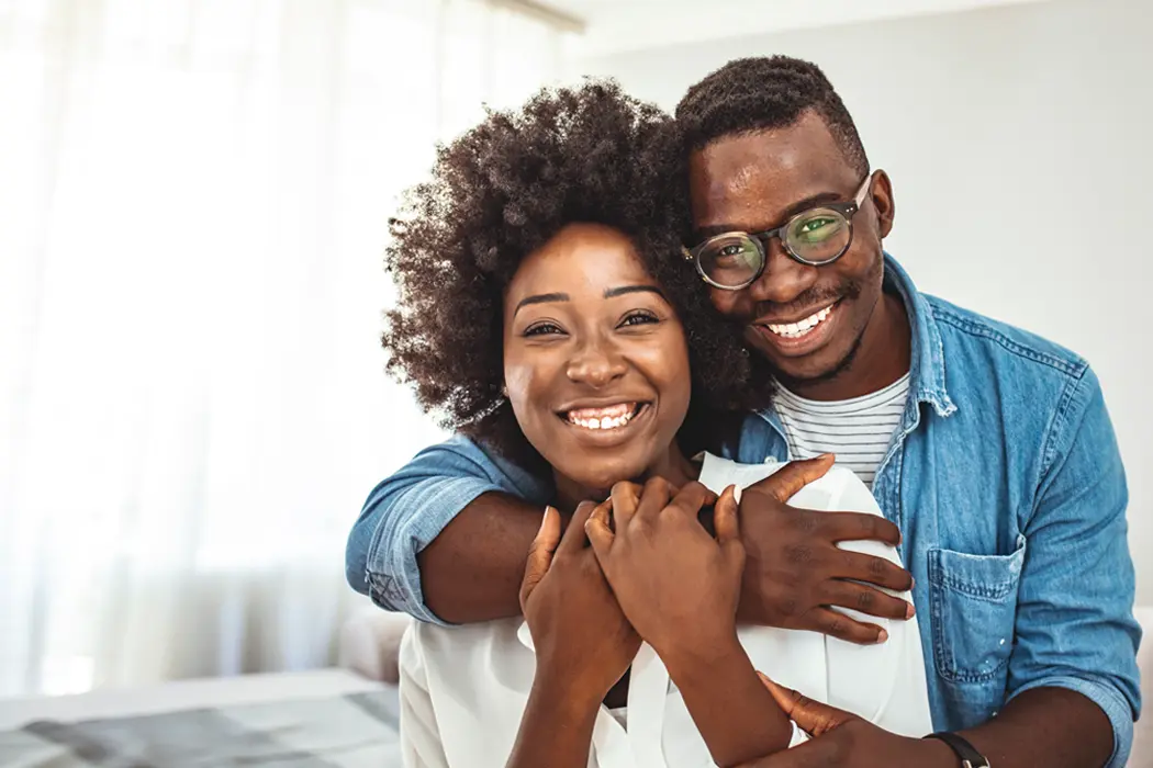Man and woman smiling 