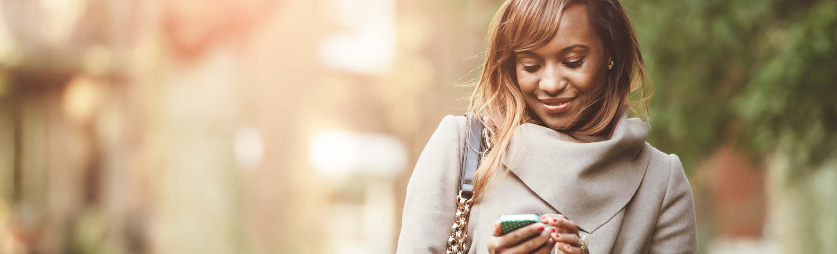 Women walking outside on phone