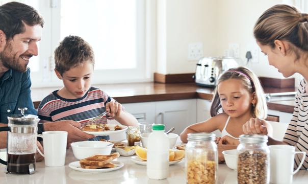 Family members eating breakfast