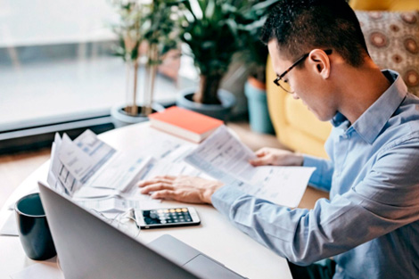 Photo of man doing taxes