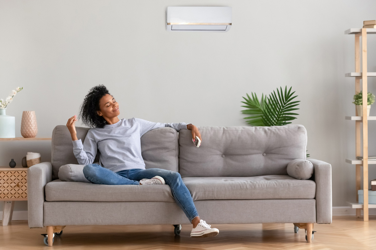 A woman relaxing on her couch