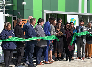 People gathered for a ribbon-cutting event