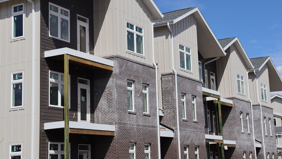 Row of homes under construction.