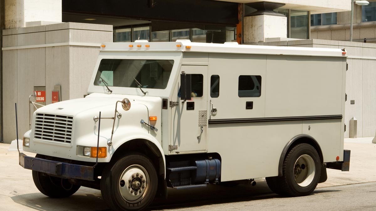 Armored vehicle parked on a busy city street