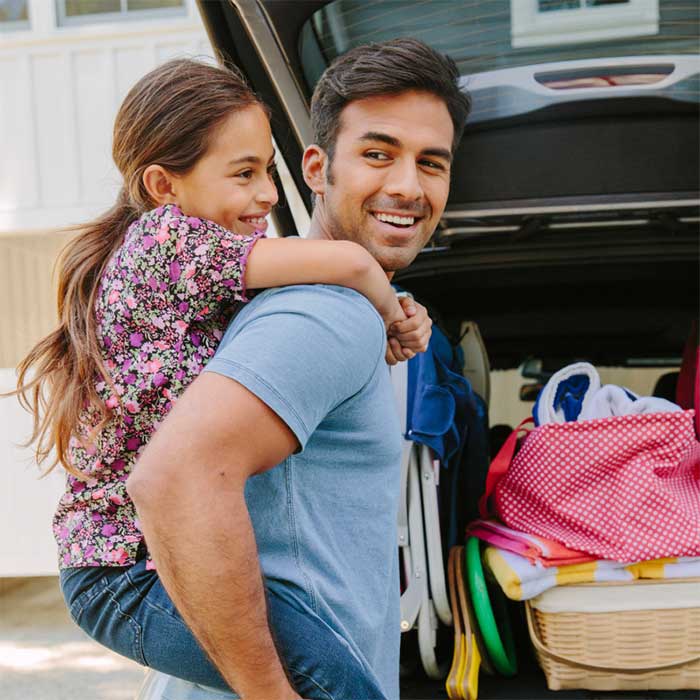 Parent and child preparing for an outing