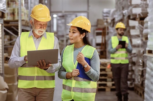 Workers walking plant floor