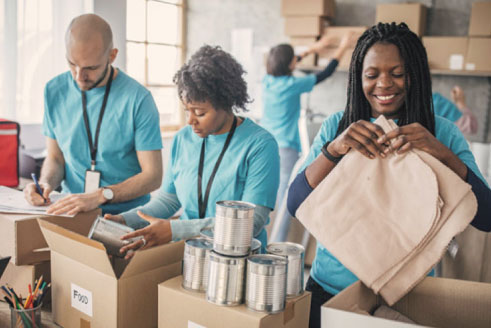 Three people volunterring