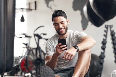 Person using a smartphone at the gym