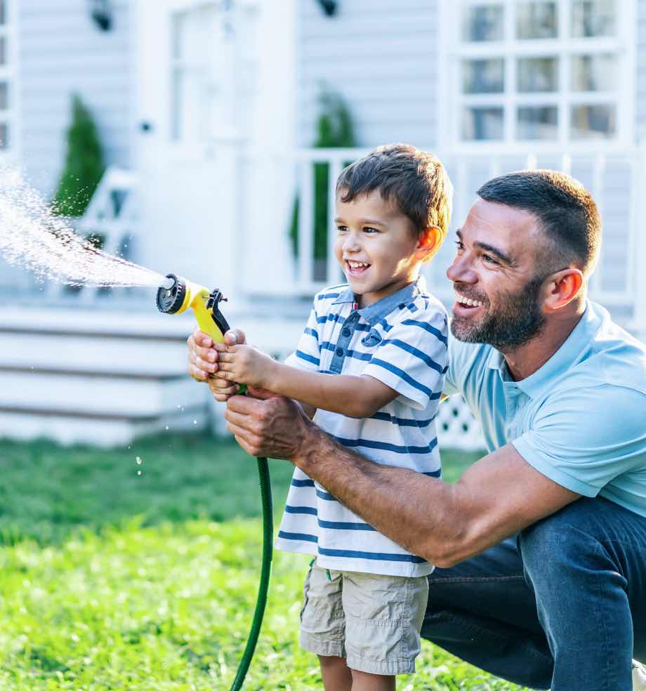 Dad and son outside home